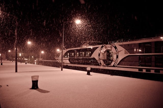 Passing Tauck's Swiss Jewel on a snowy night in one of the numerous locks that line the Danube. Photo © 2012 Aaron Saunders