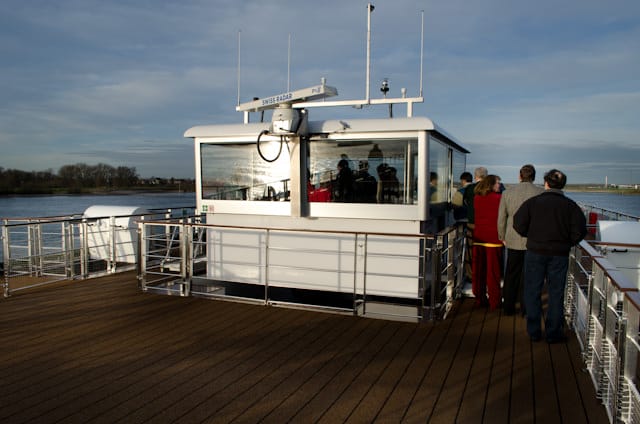 Passengers congregate on the Sun Deck for a look inside the Viking Baldur's weelhouse. Photo © 2013 Aaron Saunders