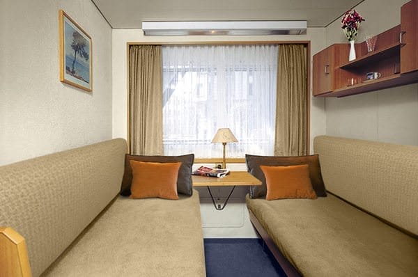 Staterooms featuring fold-out berths weren't uncommon on older river cruise vessels. Pictured here is a pre-refit photograph of one of Viking Peterhof's staterooms; they have since been substantially upgraded. Photo courtesy of Viking River Cruises