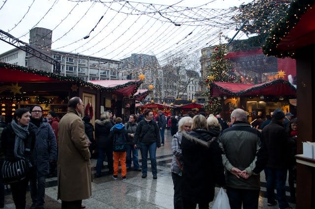 Visitors browse through one of many Christmas Markets in Cologne, Germany. Photo © 2013 Aaron Saunders