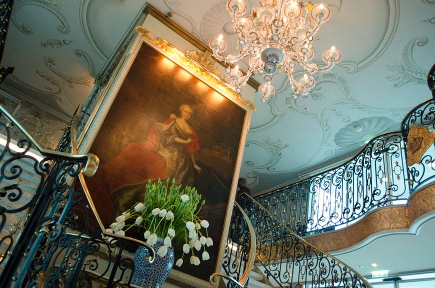 The ornate lobby welcomes guests aboard Uniworld's S.S. Maria Theresa. Photo © 2015 Aaron Saunders