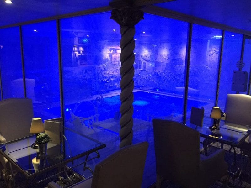 Leopard Bar swimming pool with windows that turn opaque for privacy. © 2015 Ralph Grizzle
