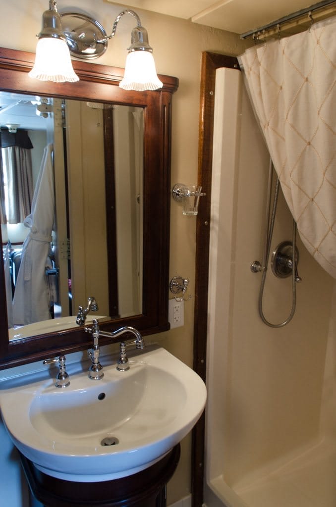 Bathrooms aboard the S.S. Legacy feature Victorian-style fixtures. Space is at a premium, but it's used well. The shower is unusually large for a ship of this size - a nice surprise! Photo © 2015 Aaron Saunders