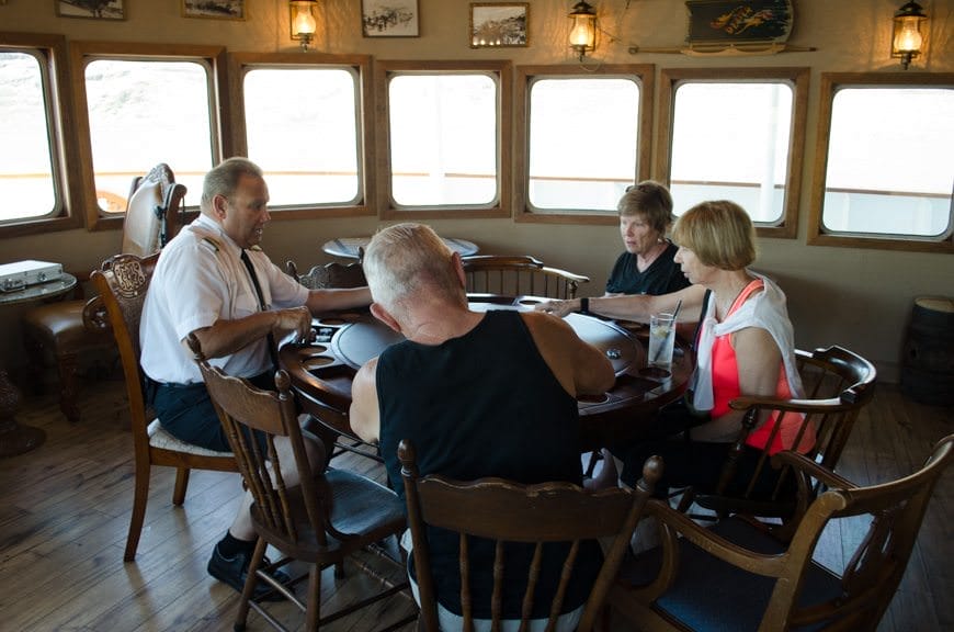 Captain Scott gets in on a friendly poker tournament in the Pesky Barnacle this afternoon! Photo © 2015 Aaron Saunders