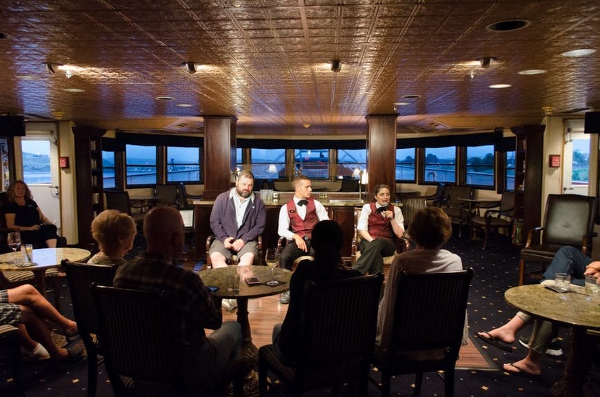Some of S.S. Legacy's crew members entertain guests in The Lounge as they present their own version of "The Liar's Club." Photo © 2015 Aaron Saunders