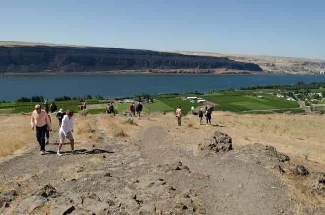 The views from Stonehenge are surprisingly nice. Here, on the Washington side of the Columbia, a recent fire can be seen, blackening the Oregonian banks of the river. Photo © 2015 Aaron Saunders