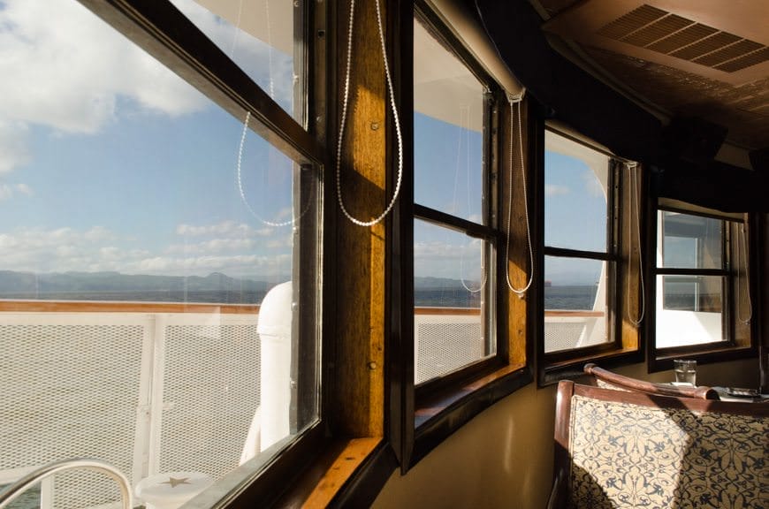 Back onboard the S.S. Legacy, flanked by the beautiful windows in the Lounge. Photo © 2015 Aaron Saunders