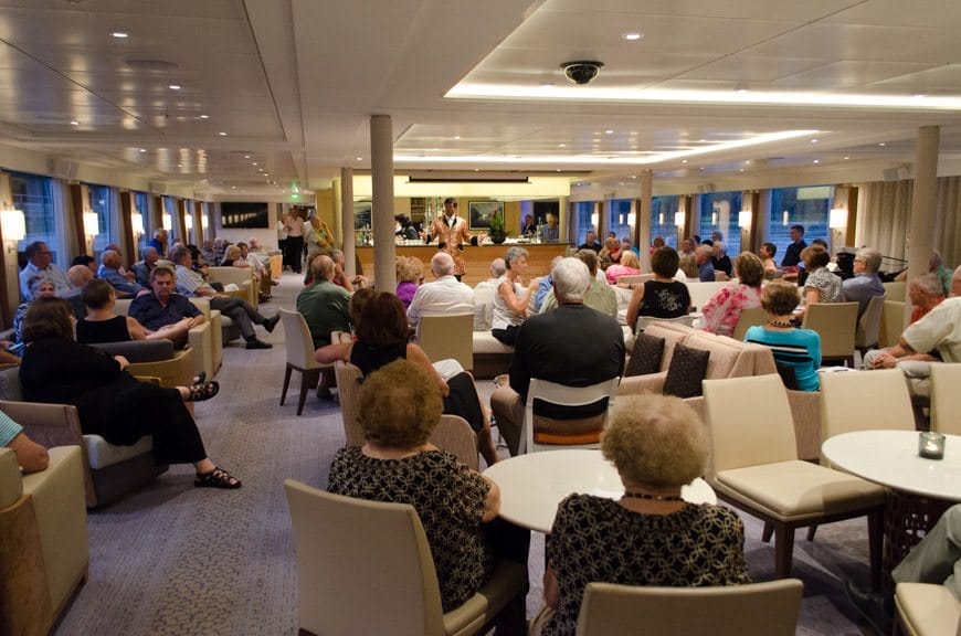Guests gather for local entertainers who came aboard Viking Vidar in the Viking Lounge. Photo ©  2015 Aaron Saunders