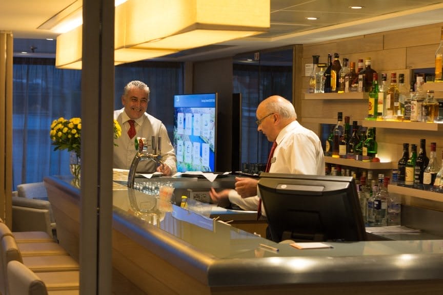 ...while the amazingly friendly bar team whips up a cocktail. Photo © 2015 Aaron Saunders