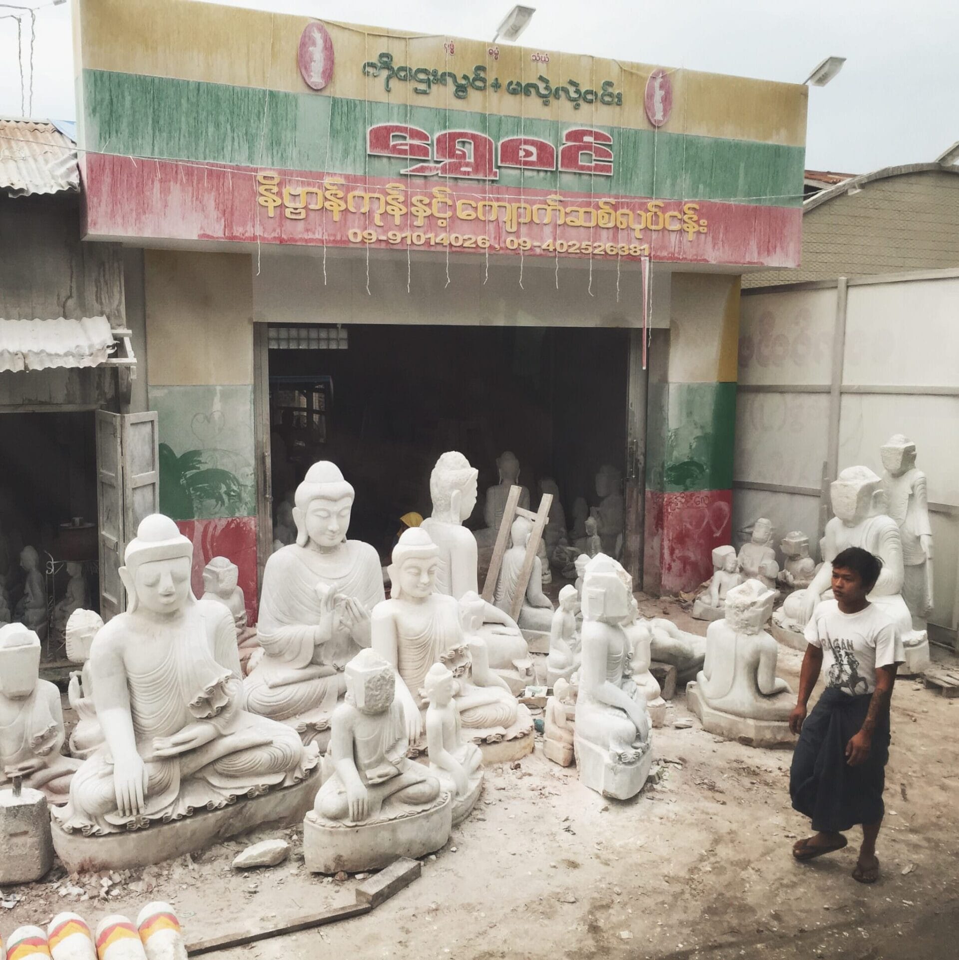 Do you see the Buddha statues with square faces? They are waiting for a master carver, the only person who is allowed to complete the sacred face. © 2015 Gail Jessen