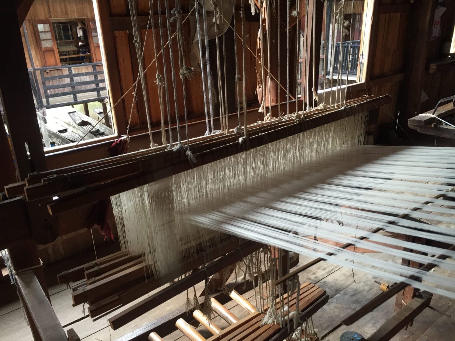 The clacking noise of manual, wooden looms was rhythmic and hypnotic. © 2015 Gail Jessen