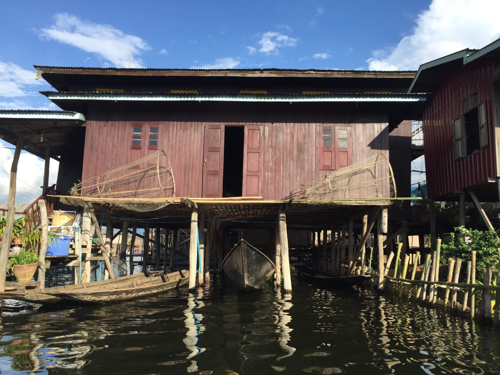 The iconic hard sided nets of the Inle Lake fishermen rest on a porch. © 2015 Gail Jessen