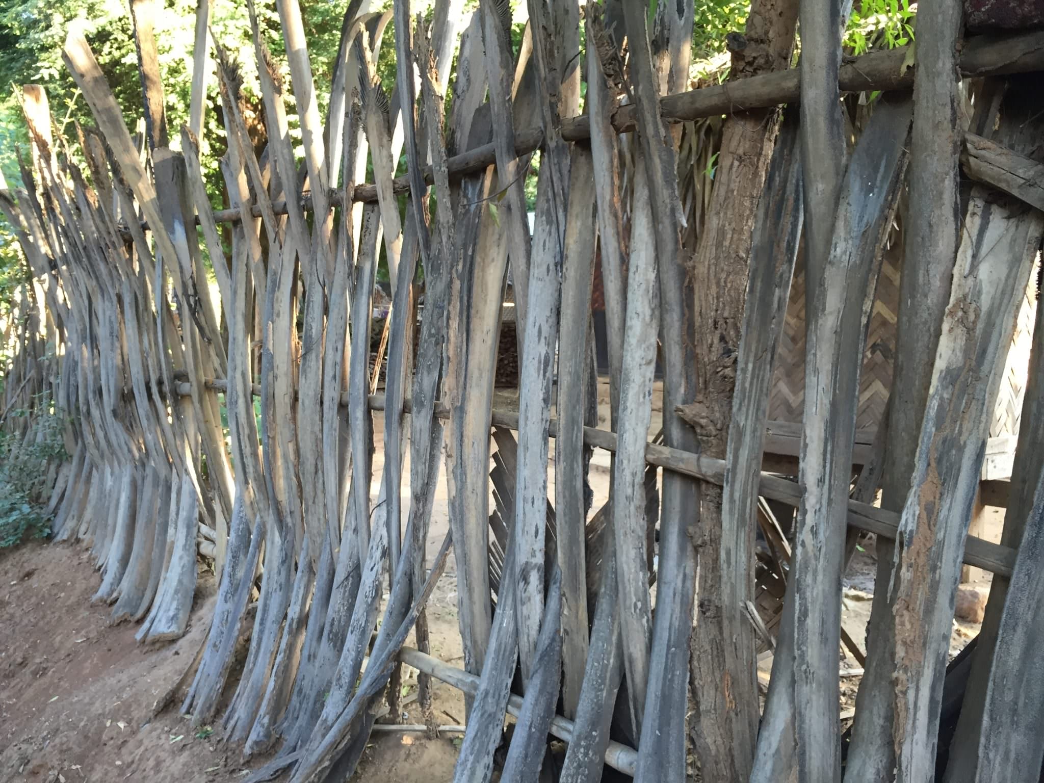 Palm fences lining every communal village street have a beautiful, sculptural design. © 2015 Gail Jessen 