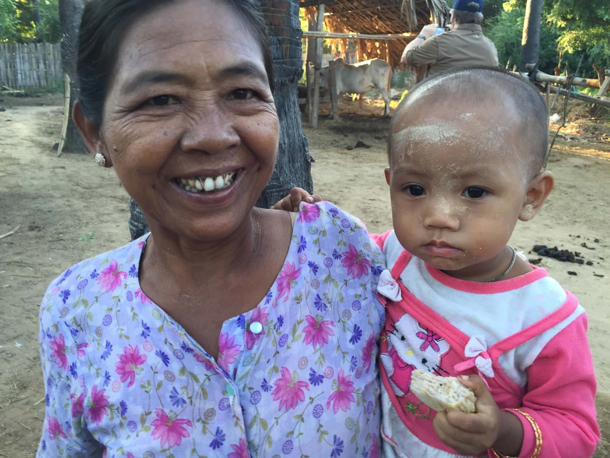 This woman requested I take a photo of her granddaughter. She wanted the baby to see her own face. © 2015 Gail Jessen