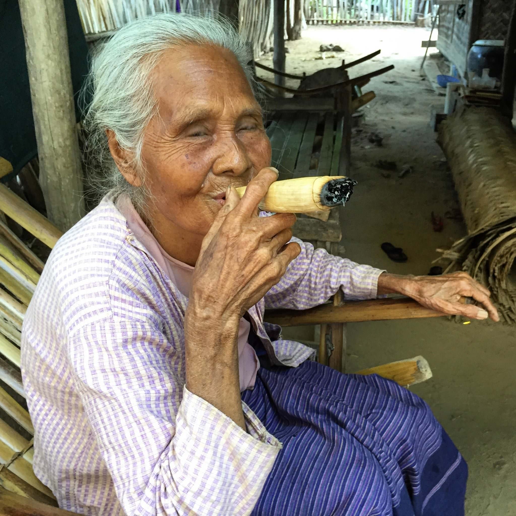 A traditional Burmese indulgence, a mix of tobacco, honey, and lime juice are rolled in a corn husk and smoked. © 2015 Gail Jessen