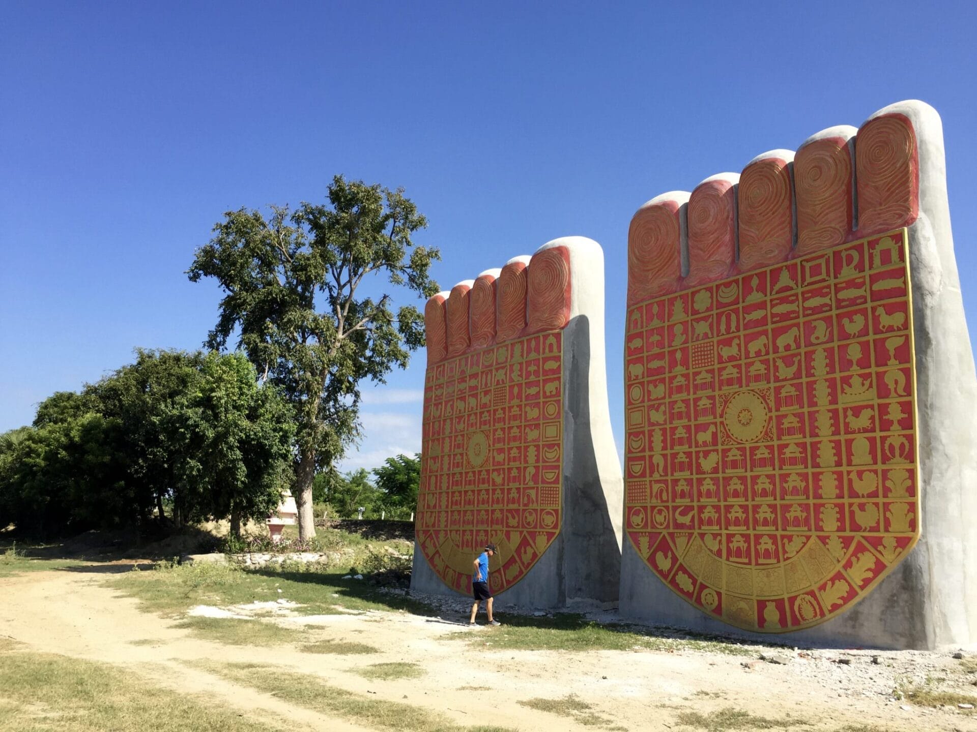 Viking Mandalay: 500,000 Buddhas In Monywa, Myanmar 26 A fellow passenger at the base of the model for the standing Buddha. © 2015 Gail Jessen