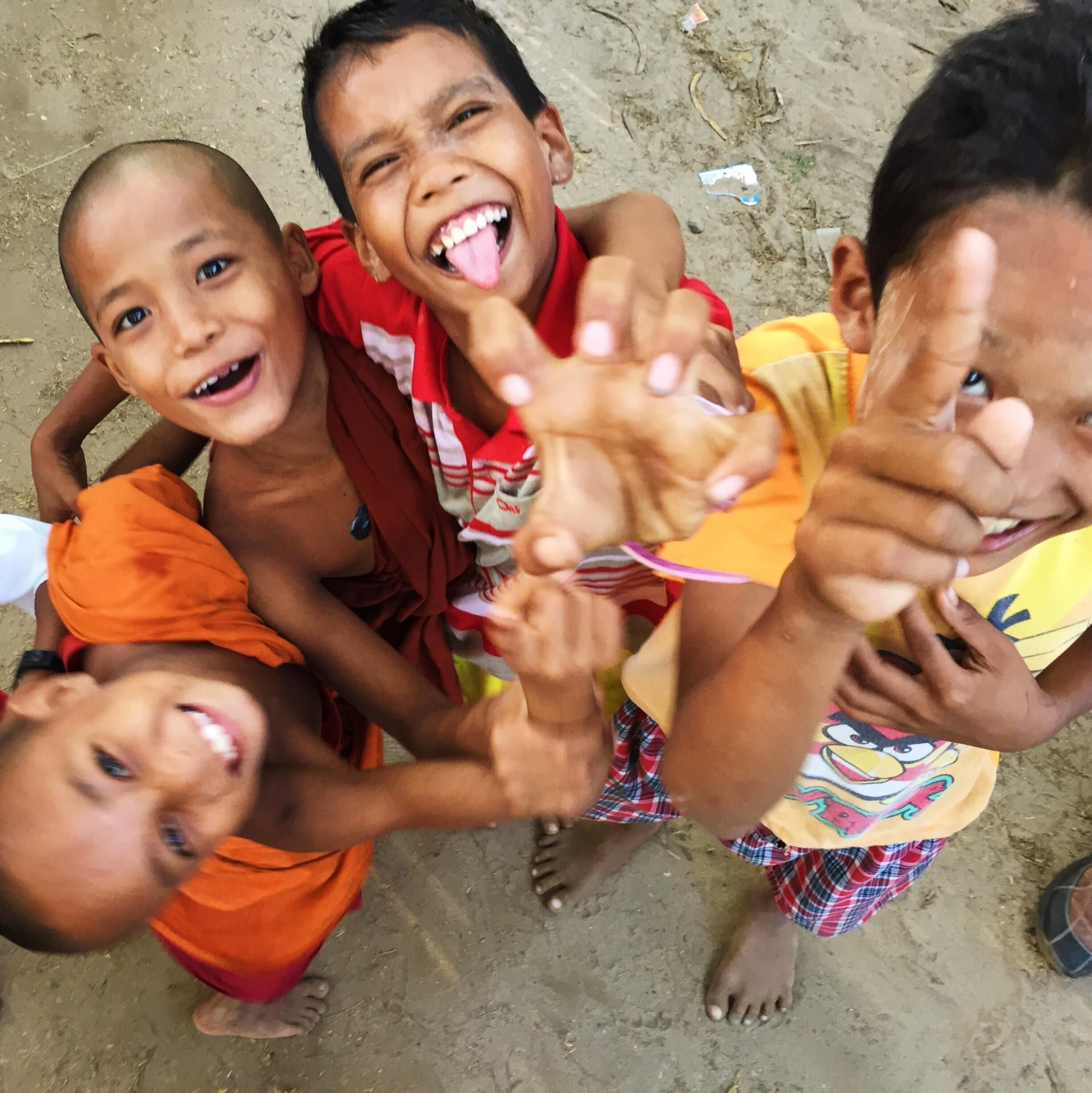 Children in Ohn Ne Choung going nuts to see themselves in my iPhone selfie screen. © 2015 Gail Jessen
