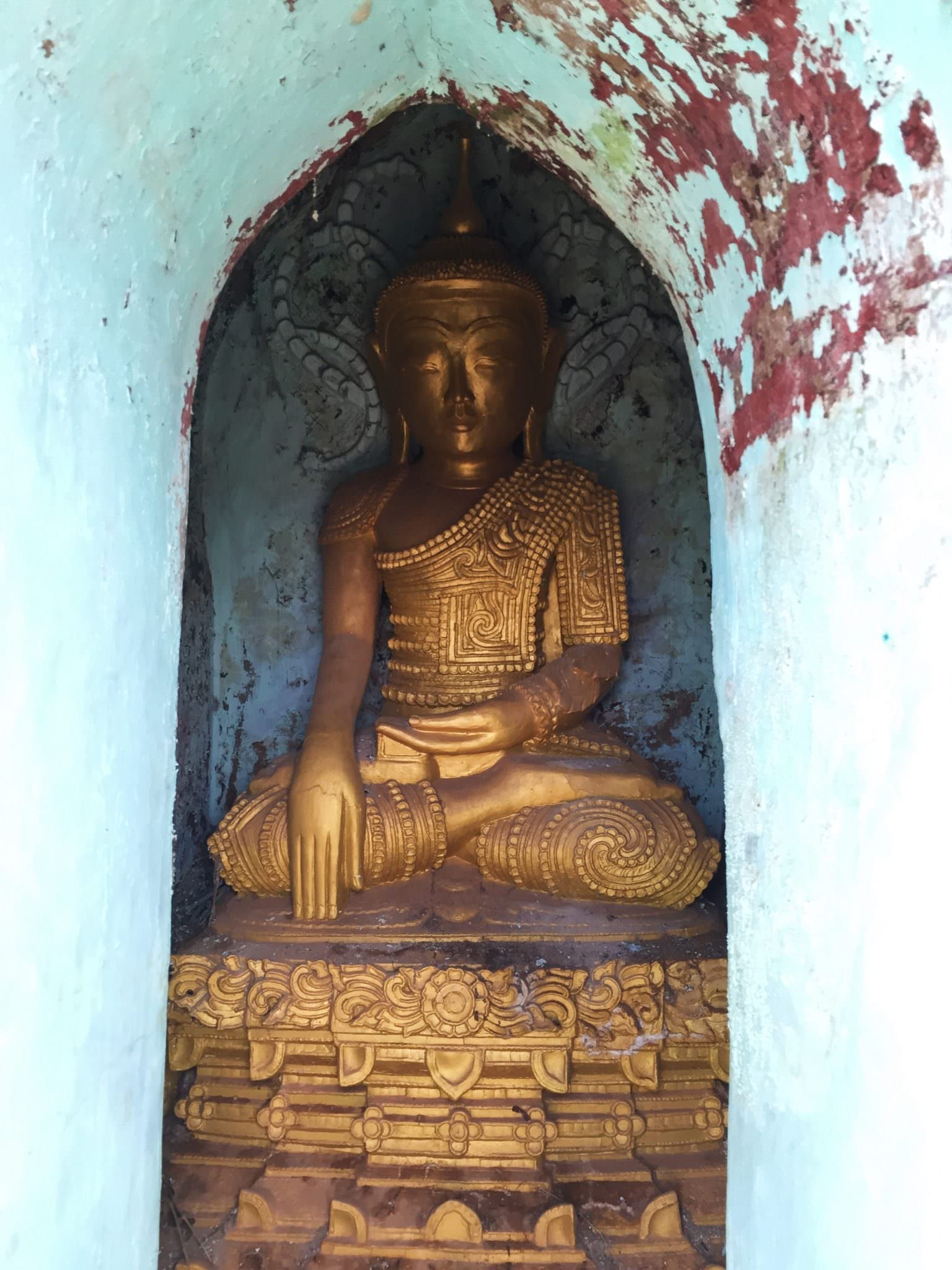 Each stupa had a Buddha statue tucked inside. It was a fascinating game to see how they changed from structure to structure. © 2015 Gail Jessen