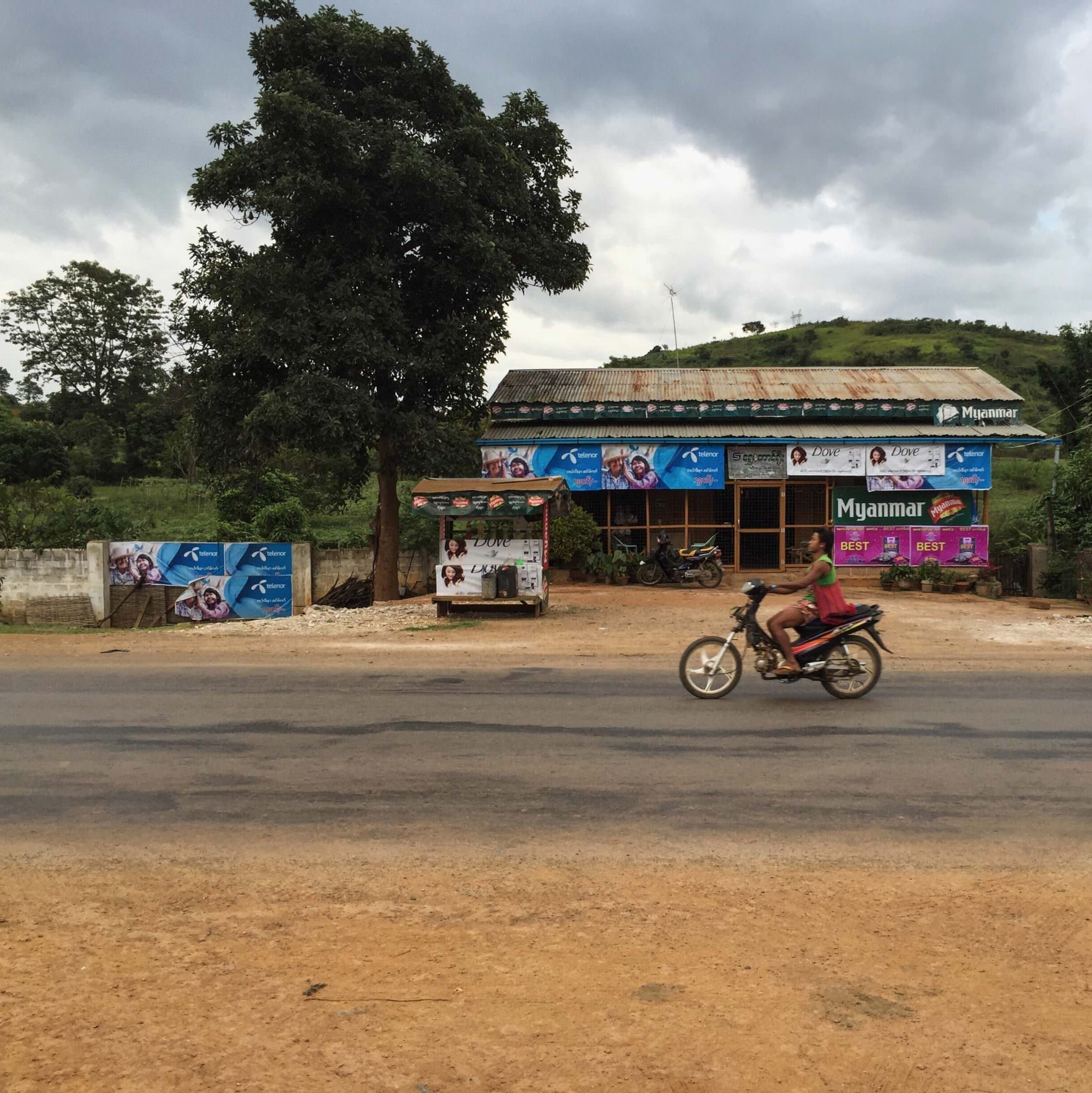 While Yangon banned scooters in the capital city, there are plenty in the countryside. The economical form of transportation well outnumbering cars. © 2015 Gail Jessen