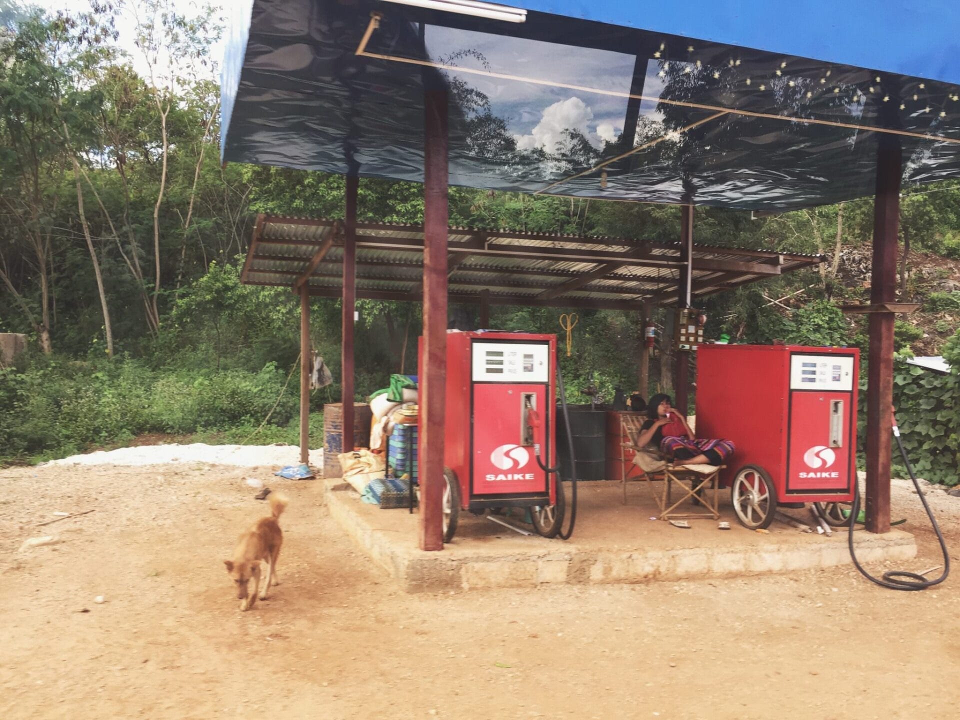 In addition to gas stations, there are recycled water bottles full of gasoline for sale in front of nearly every little roadside shop, good for a quick top off on your scooter. © 2015 Gail Jessen