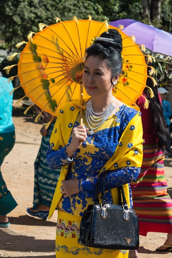 Many women wore the beautiful and traditional ceremonial dress of Myanmar...Photo © 2015 Aaron Saunders