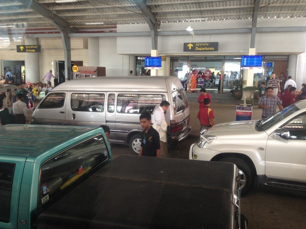 Yangon's diabolical traffic gave way to an equally chaotic scene outside Yangon's Domestic Airport. Photo © 2015 Aaron Saunders