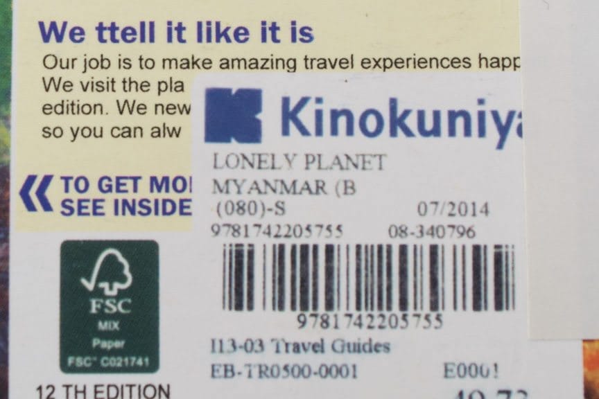 "We ttel it like it is." A counterfeit Lonely Planet guidebook is easy to spot...but only if you look closely. Note the "sticker" that's actually imbedded into the printed graphic on the book cover. Photo © 2015 Aaron Saunders