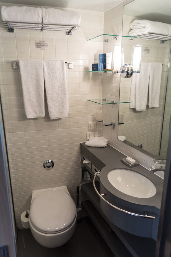 My stateroom bathroom. I call this "Bathroom 1.0", as Viking has changed lighting, shelving, textures, and wall treatments on later Longships. But I still love this version, particularly the towel rack on the sink. Photo © 2016 Aaron Saunders